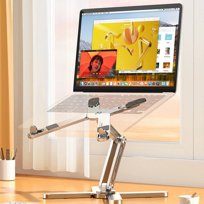 Foldable laptop stand supporting a laptop on a desk